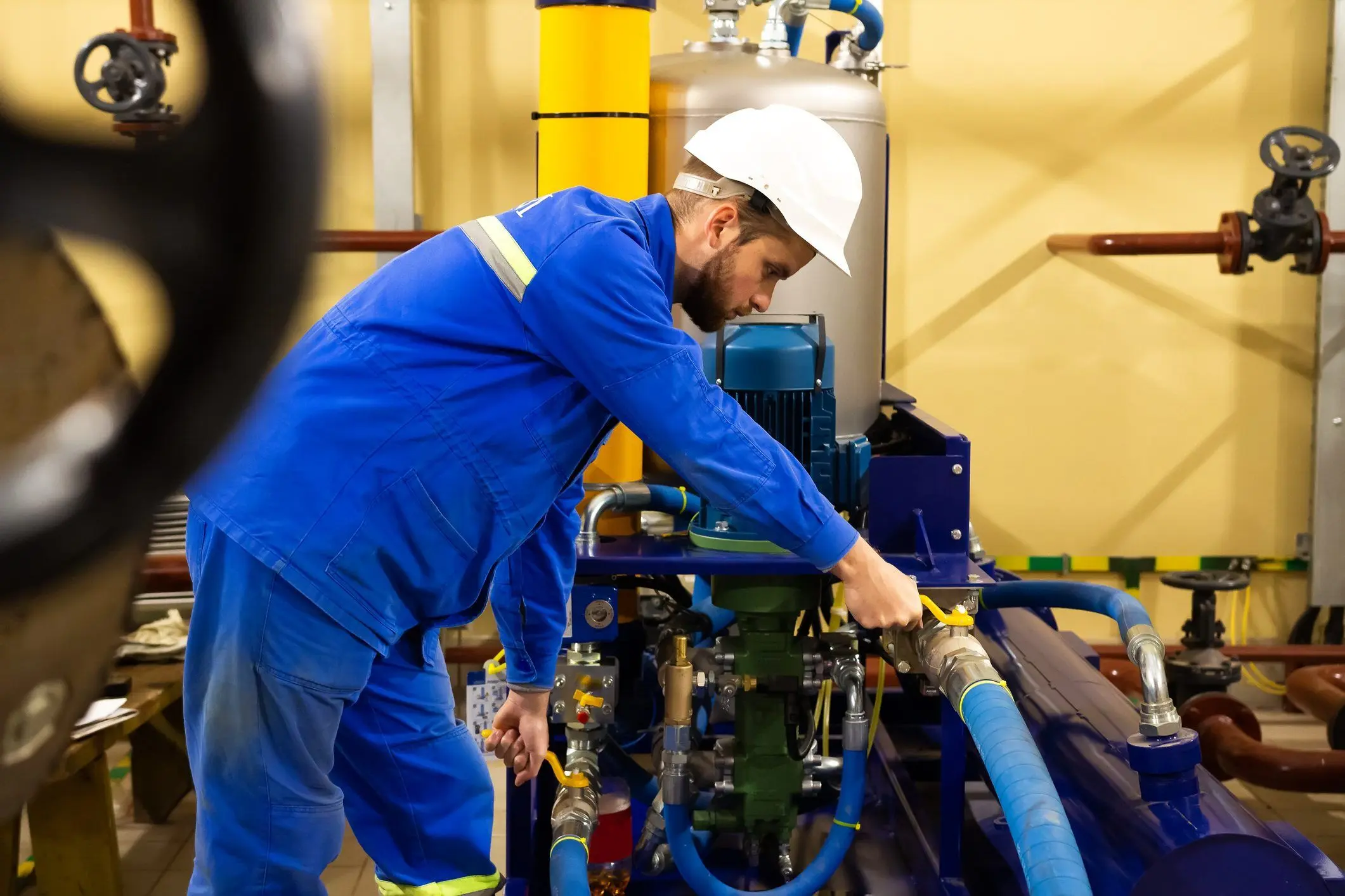 Industrial worker testing valves