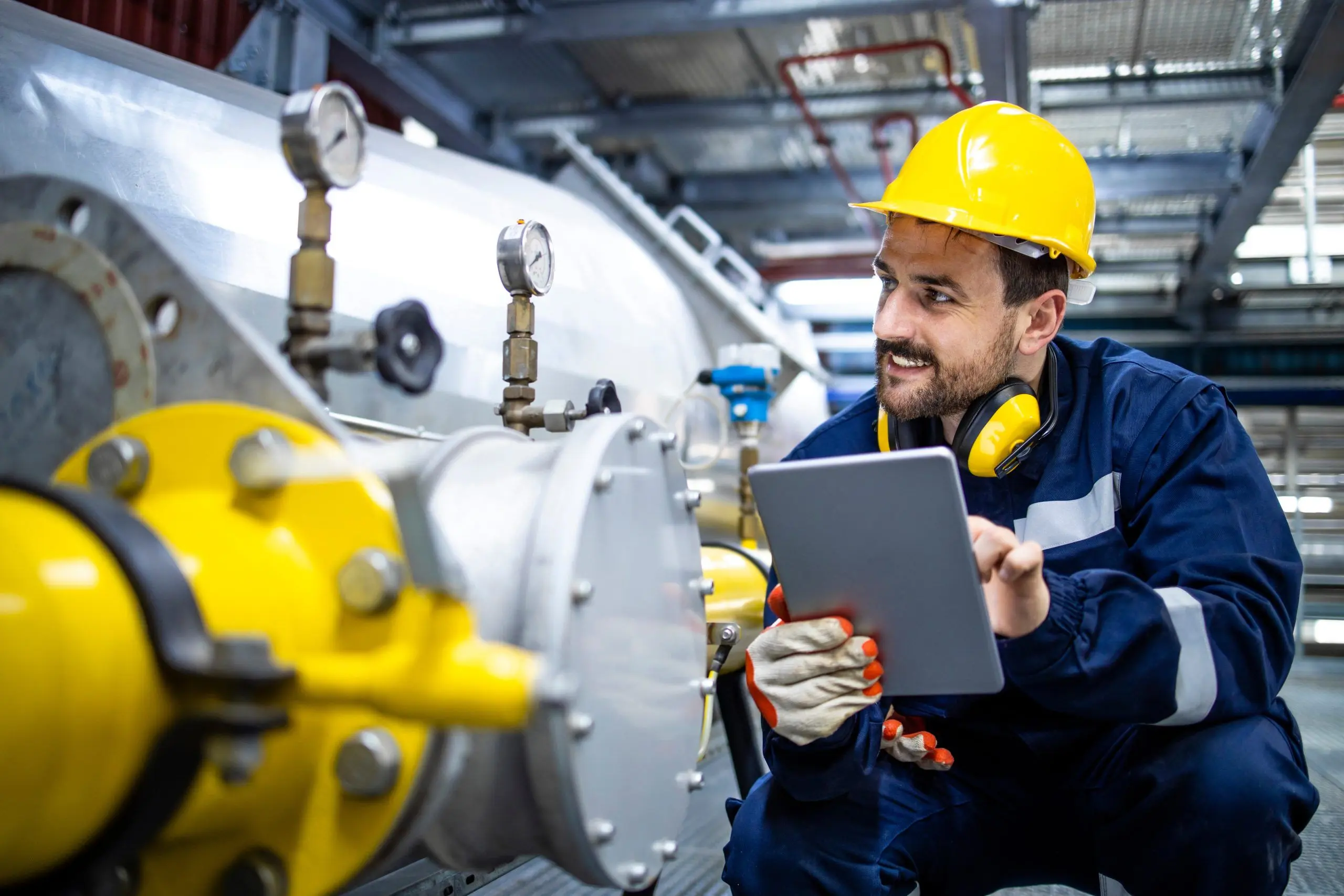 Refinery worker checking gas storage